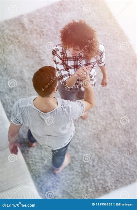 Young Couple Give Each Other Five In New Living Room Stock Image