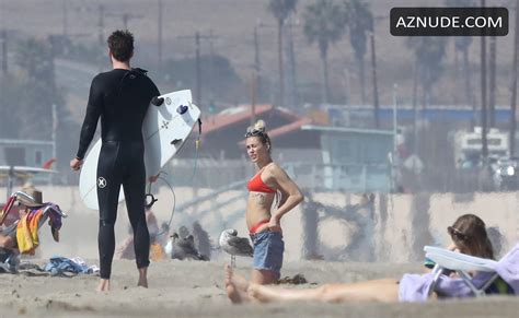 Miley Cyrus Sexy In A Cheeky Red Bikini With Boyfriend Liam Hemsworth In Malibu AZNude
