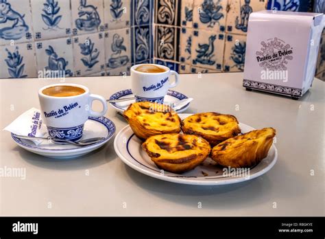 Pastel De Belem Or Pasteis De Nata Custard Tarts Served With A Cup Of