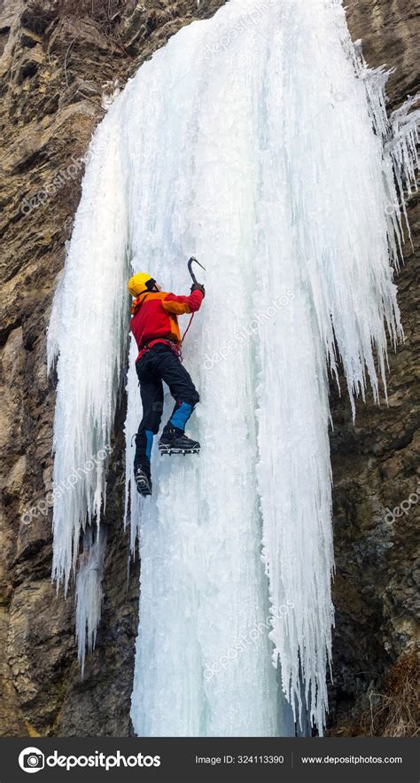 Man Climbing Frozen Waterfall Using Ice Axes Crampons Extreme Ice Stock