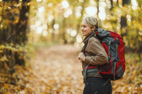 Premium Photo Shot Of A Mature Woman Walking Through The Forest In