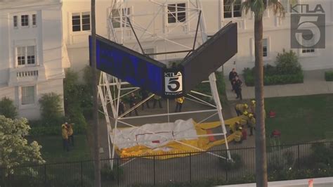 Man Climbs Ktla Tower In Hollywood Holding Free Billie Eilish Sign