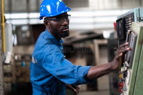 Black Male Engineer Working On Machine In Factory Black Man Engineer