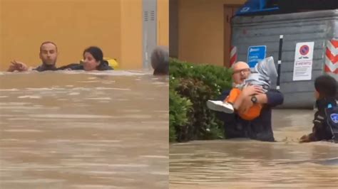 Neighbours brave rising flood waters to rescue mother-daughter in Italy ...