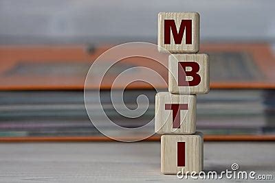 Mbti Acronym On Wooden Cubes On The Background Of A Folder With