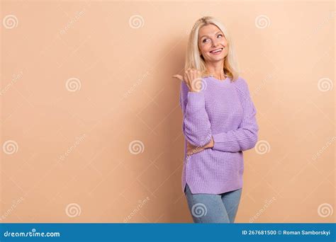 Photo Of Cheerful Nice Elderly Lady With Blond Hairdo Wear Knit Sweater