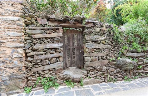 Premium Photo A Vegetable Garden With An Old Wooden Door With A Rusty