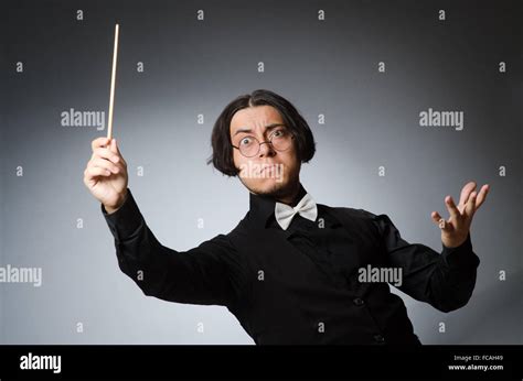 Funny conductor in musical concept Stock Photo - Alamy