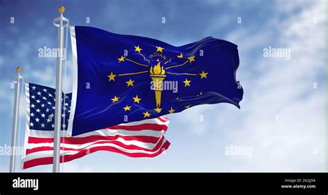 The Indiana State Flag Waving Along With The National Flag Of The