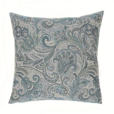 A Blue And White Paisley Pillow On A White Background