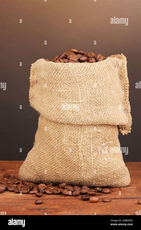 Coffee Beans In Bag On Table On Dark Background Stock Photo Alamy