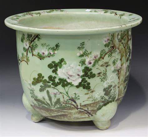 A Japanese celadon glazed porcelain jardinière 20th century enamelled