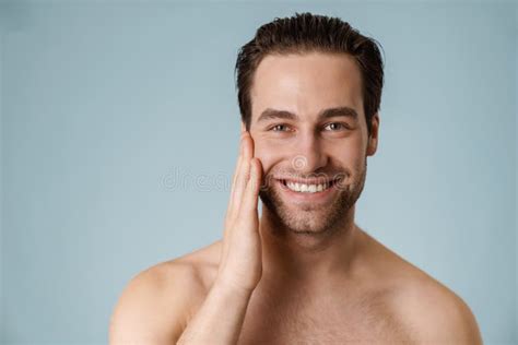 Close Up Of A Smiling Brunette Shirtless Man With Stubble Stock Photo