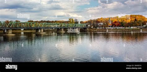 Panoramic Fall Scene Of A Bridge Across The Delaware River From Bucks