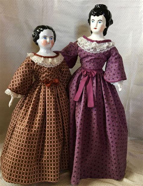 19th Century China Dolls Are Dressed In Pagoda Sleeve Dresses Trimmed