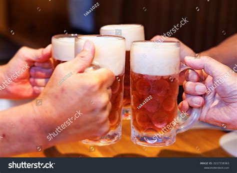 People Toasting Mugs Draft Beer Restaurant Stock Photo