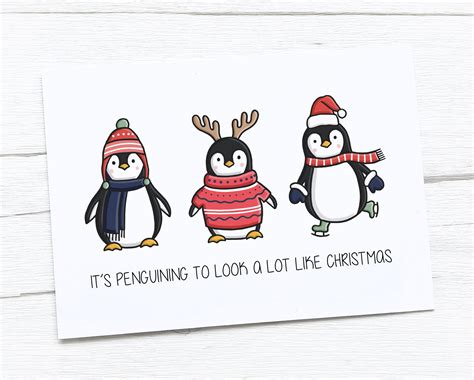 Three Penguins Wearing Sweaters And Hats With The Words It S Penguining