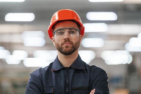 Premium Photo Focused Portrait In Glasses Factory Worker Is Indoors