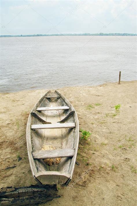 Piragua of fisherman & Amazon river — Stock Photo © toucanet #72417725