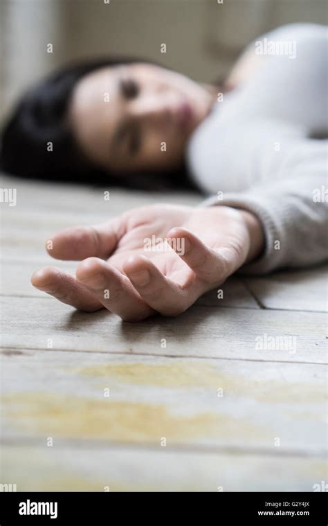 Dead woman on the floor Stock Photo - Alamy