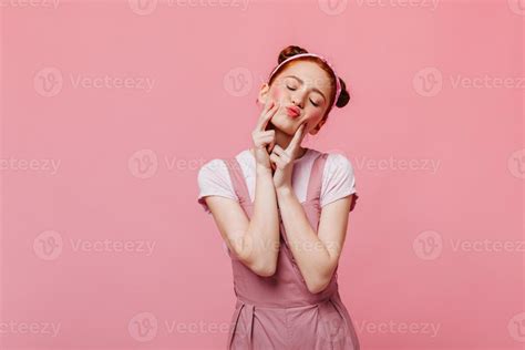 Portrait Of Perky Young Woman In Bright Outfit Making Face On Pink