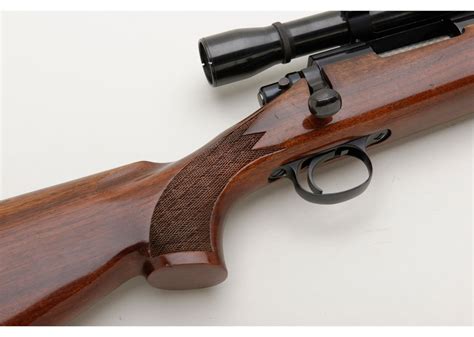 Remington Model 700 bolt action rifle, .243 cal. with side swing mounted scope (K-4 Weaver); very go