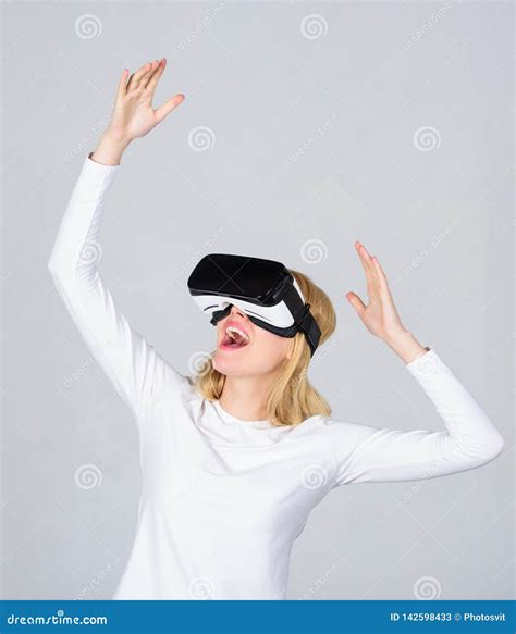 Portrait Of Young Woman Wearing Vr Goggles Experiencing Virtual