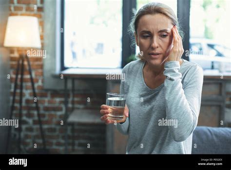 Concerned Mature Woman Sweating Heavily Stock Photo Alamy