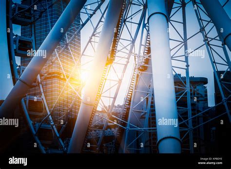 Big ferris wheel with cityscape in background Stock Photo - Alamy