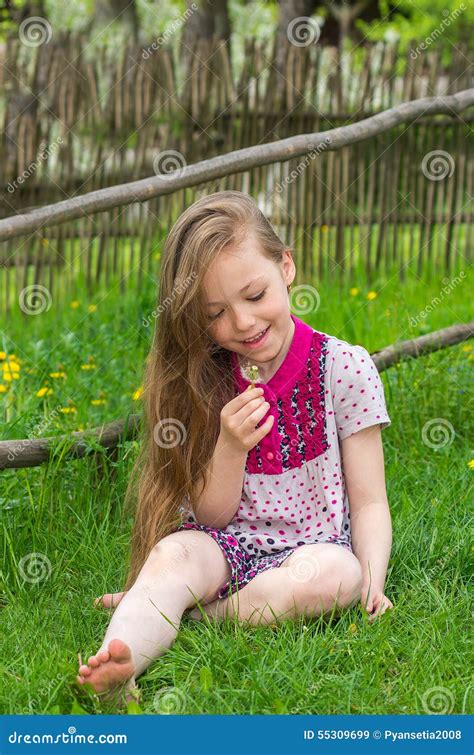 Happy Cute Little Girl Sitting On The Grass Stock Image Image Of