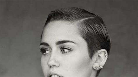 Miley Cyrus sports funky tattoo inside lower lip