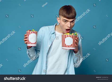 Man Eating Popcorn Watching Movie Stock Photo 1324500734 | Shutterstock