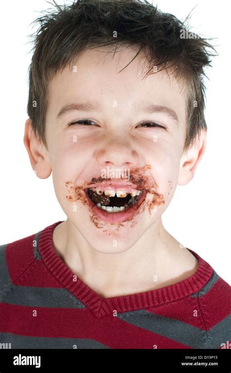 Smiling Kid Eating Chocolate Smeared Stained With Chocolate Lips