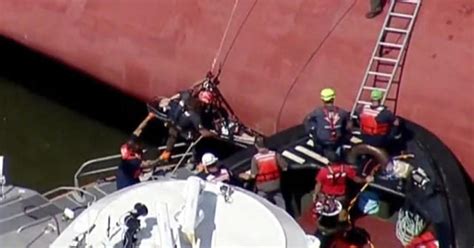 Crew Members Rescued From Overturned Cargo Ship Cbs News