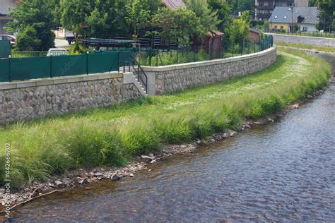 Modern Flood Protection Wall In The Style Of The Historic City Wall