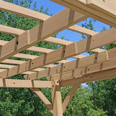 A Wooden Pergola In Front Of Some Trees