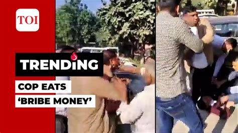 Caught On Cam Police Officer Eats Bribe Money During Vigilance Raid To