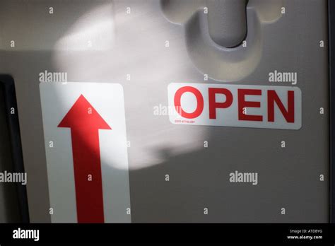 Emergency exit in the airplane Stock Photo - Alamy