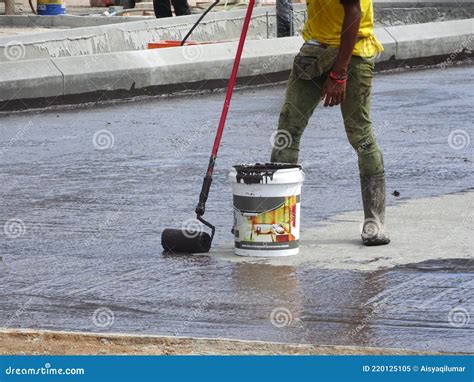 Waterproofing Membrane Applied By Construction Workers On Top Of Concrete Slab Editorial Image