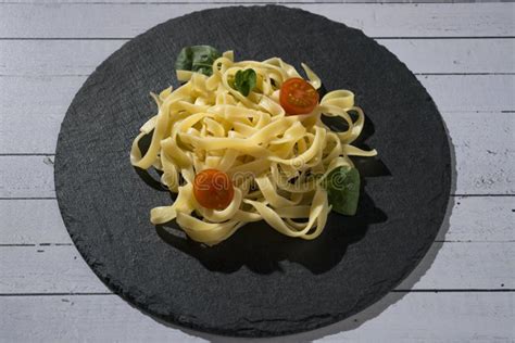 Homemade Fresh Pasta Spaghetti Dish With Tomato And Oregano Stock Photo