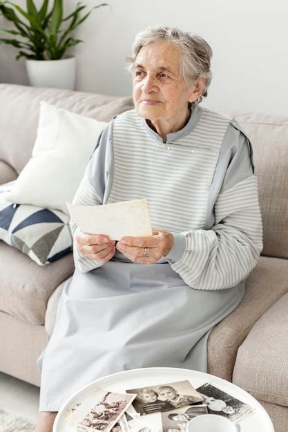 Free Photo Portrait Of Grandmother Sitting On The Couch