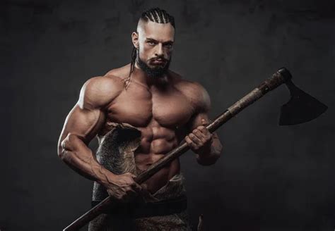 Viking With Huge Biceps And Naked Torso Posing With Axe Stock Photo By