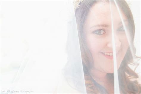 A Woman Wearing A Veil And Smiling For The Camera