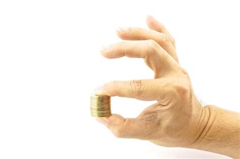 Premium Photo Close Up Of Man Holding Coins Against White Background