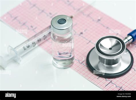 Electrocardiograph With Syringe Vial And Stethoscope Stock Photo Alamy