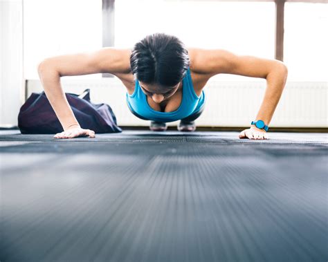 Young Woman Doing Push Ups Hybrid Fitness