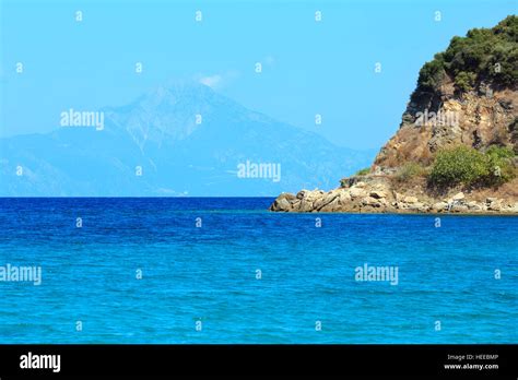 Aegean Sea Coast Landscape With Aquamarine Water And Mount Athos In