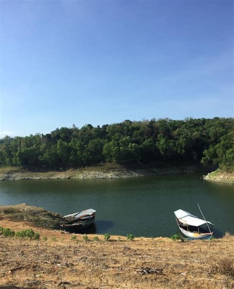 Premium Photo Boat Moored On Shore Against Sky