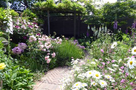 A Lush Cottage Garden In A Small Urban Backyard