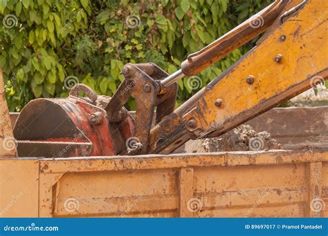 Excavator Working Machine Loading Soil Or Sand Into Truck Body Stock